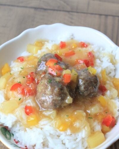 Best baked meatballs on a fork and white plate