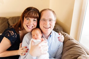 Lexi and Clint holding their son when he was newborn