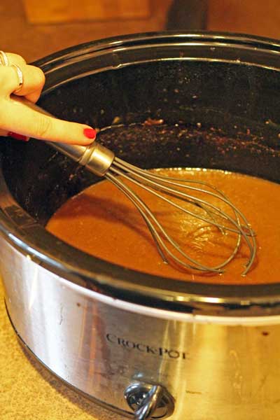 crockpot and whisk with au jus 