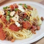 plate of Slow Cooker Cincinnati Chili on a white plate on a wood tray
