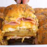 Breakfast slider being served with spatula showing all the delicious layers