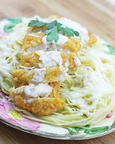 Crispy Lemon Chicken on a plate set on a wood table