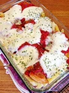 Cheater chicken parm in a glass pan with all ingredients after baking