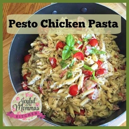 Pesto Chicken Pasta text overlay with the dish in a black pan with the joyful momma logo