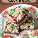 Christmas fudge cookie bars stacked on a christmas plate