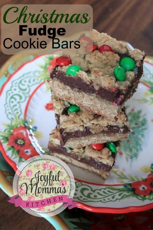 Christmas Fudge Cookie Bars title with cookies stacked on a christmas plate