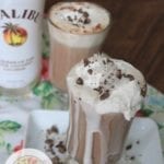 Coconut Rum Hot Cocoa text with an overflowing beverage on a white plate