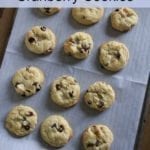 White Chocolate Cranberry Cookies text with cookies on a cookie sheet