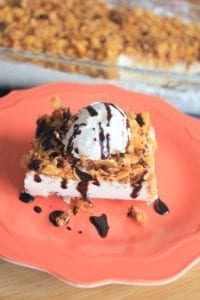 Fried icecream on a red plate with a glass pan in the background