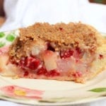 Cranberry Pear Crumb Pie on desert rose plate with white background