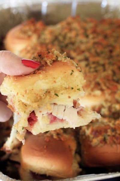 Thanksgiving Sliders being held by a hand with red nail polish