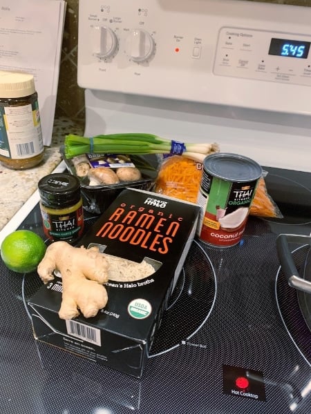 Spicy Thai Vegetable Ramen ingredients sitting on a stove top