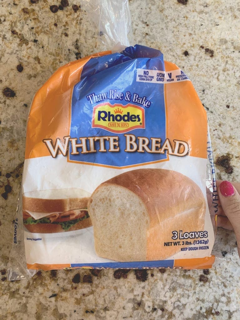 Bag of white bread sitting on counter