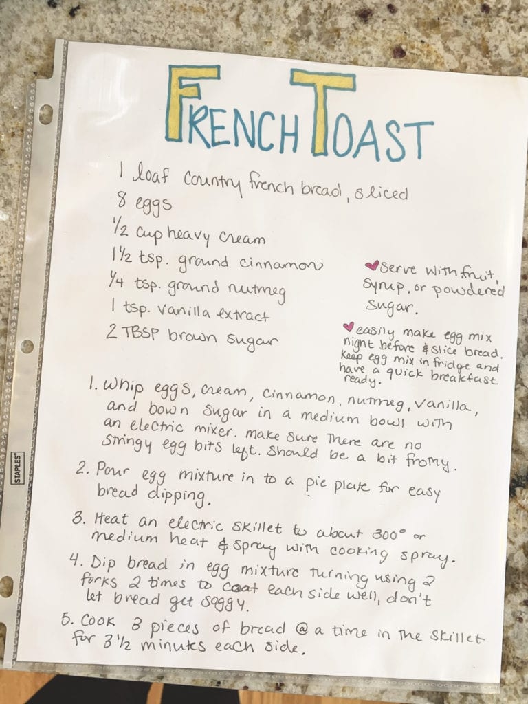 hand written French Toast recipe in a page protector sitting on counter