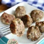 Best baked meatballs on a fork and white plate