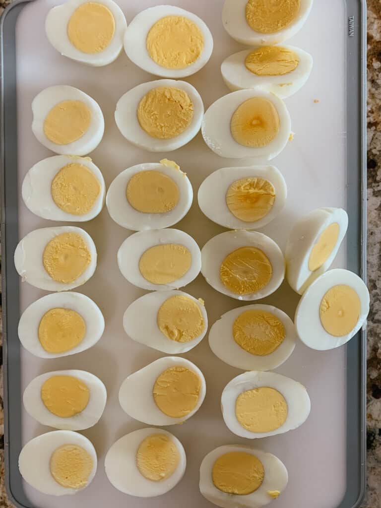 hard boiled eggs, sliced open with yellow yolks