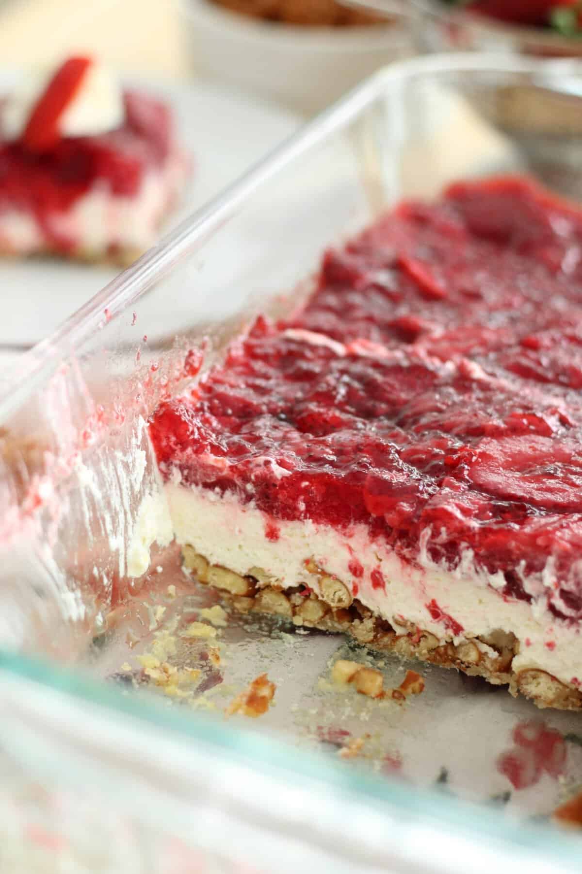 Glass cake pan with strawberry Jello salad 
