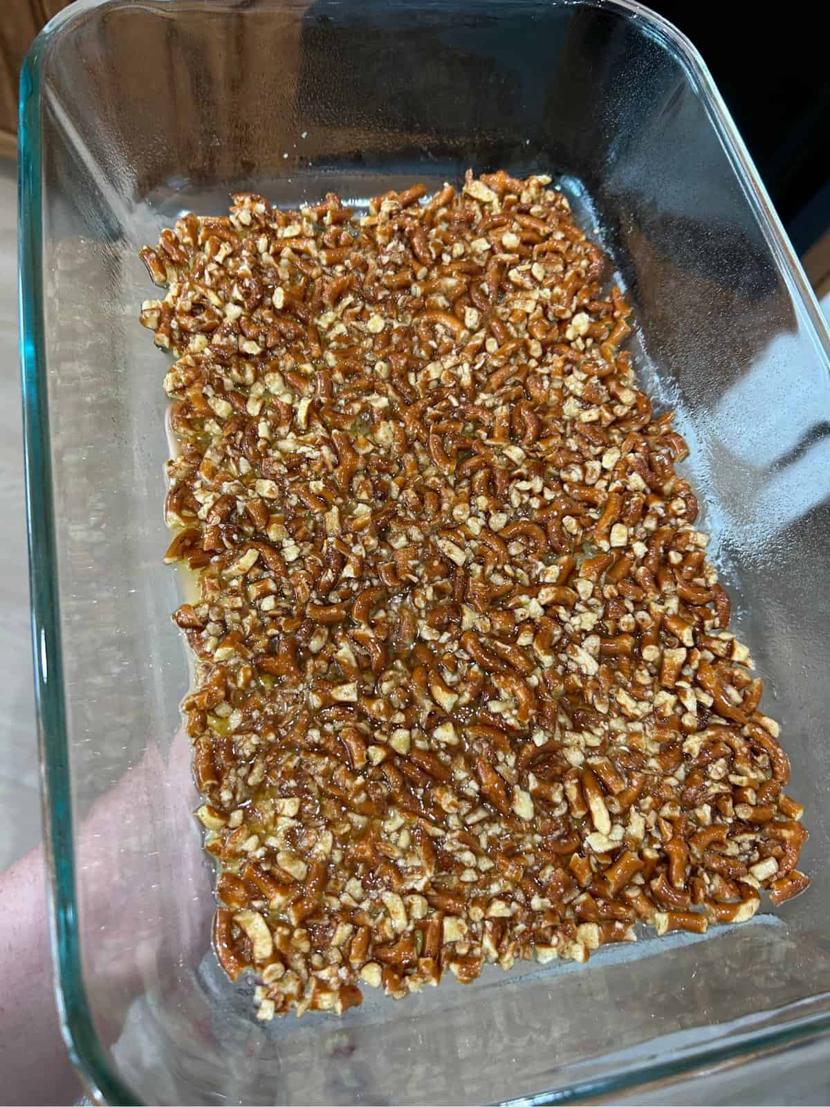Crushed pretzels in glass cake pan